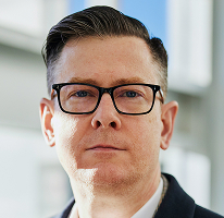 Porträt von Alexander Hughes, CEO und Führungskraft eines Krypto-Handelsunternehmens